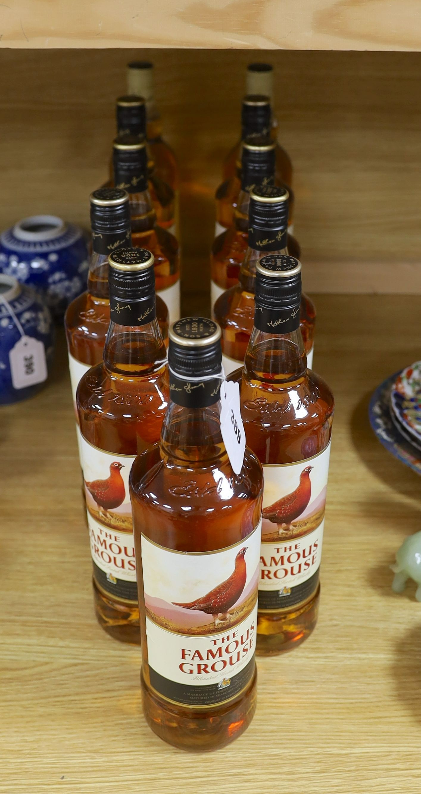 Eleven single litre bottles of The Famous Grouse scotch whisky